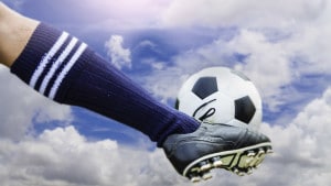 Kicking football ball